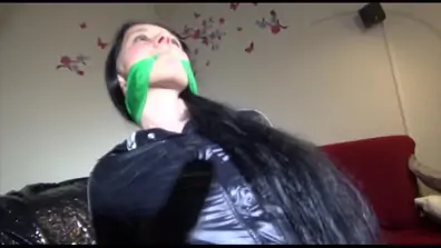 Get 2 videos of lucy tied and gagged in shiny nylon rain and sportswear from our 2015 archives