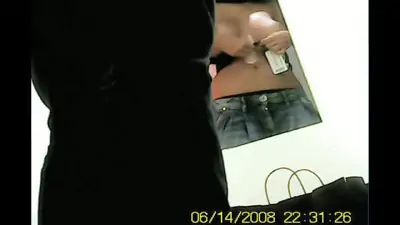 Girl shows her nude tits in the mirror of fitting room