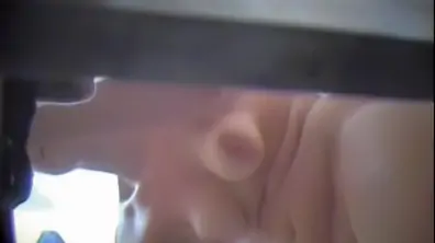 Fem putting on bikini on the changing room