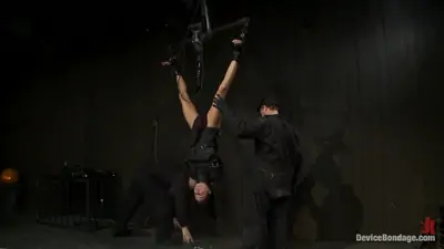 Bound in a straightjacket inverted suspendedfucked by a machine made to suck cock and zippered