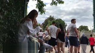 White sneaker socks and some bare feet in the background
