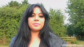 Fat brunette is kneeling in front of two guys in the forest and sucking their cocks