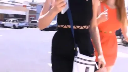 Girls defiles on the street showing off their asses