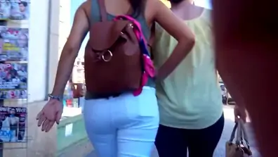 Hot brunette in white jeans