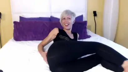 Blonde teases in yoga pants and dildo