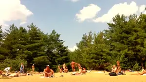 Naked people enloyong the sun on the beach