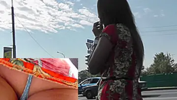 Upskirt outdoor video with dark haired girlfriend