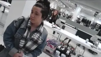 Upskirt black tights and heels out shopping with face