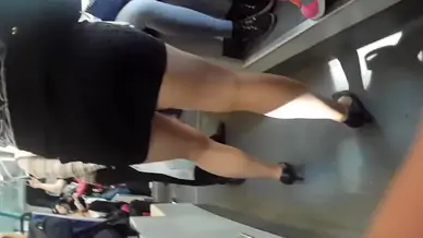 Striking young woman gets filmed from below while in a sexy