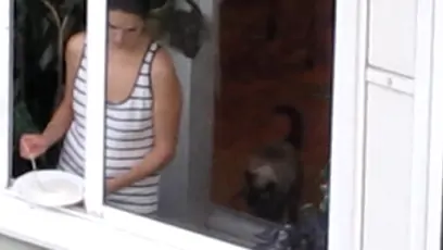 Sexy bird in the window making cereal wearing a thong