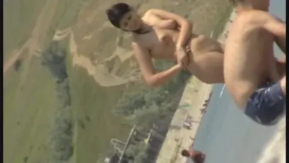Dude peeks on a gal who undresses before swimming