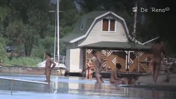 Naked people are having some good time on the beach