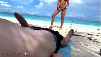 Horny european brunette fucks on public beach
